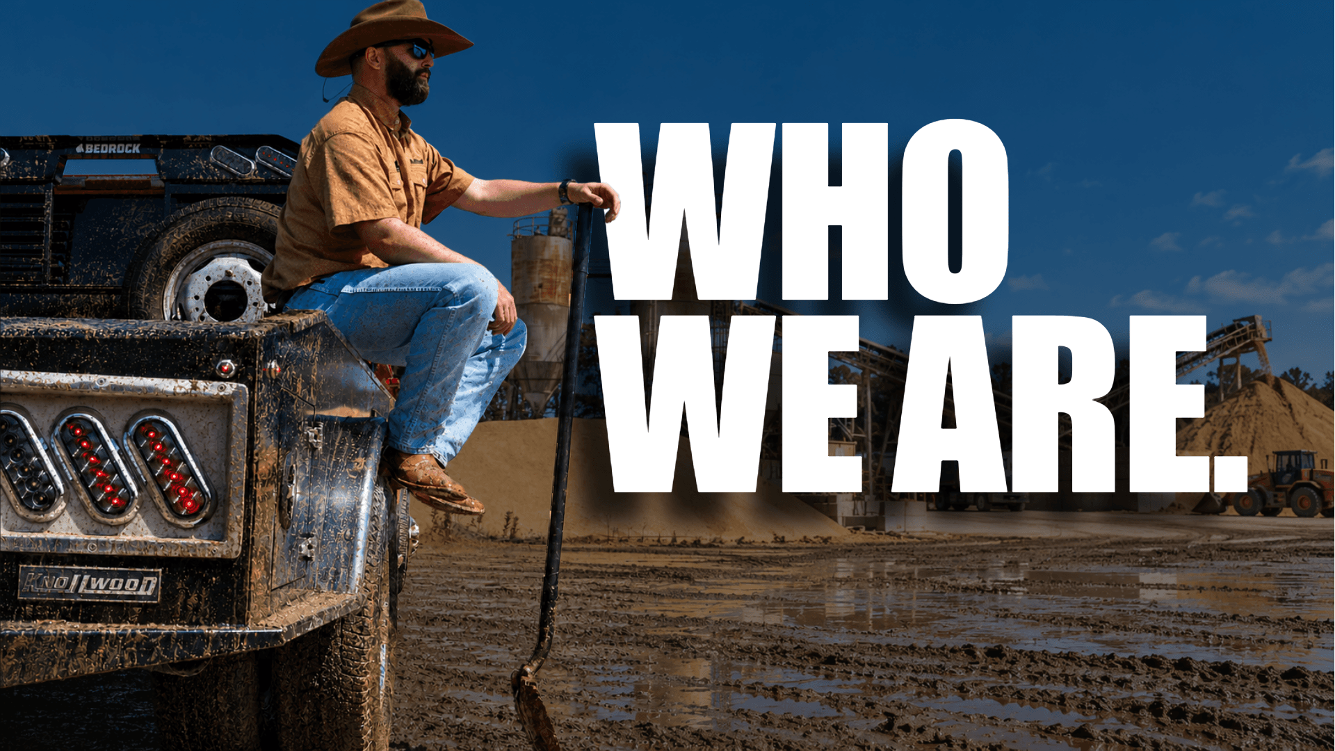 Who we are: Justin in a cowboy hat seated on a Knollwood Upfitters truck